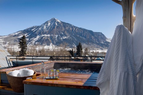 Head back in the cat for a hot tub soak and a fun dinner in town